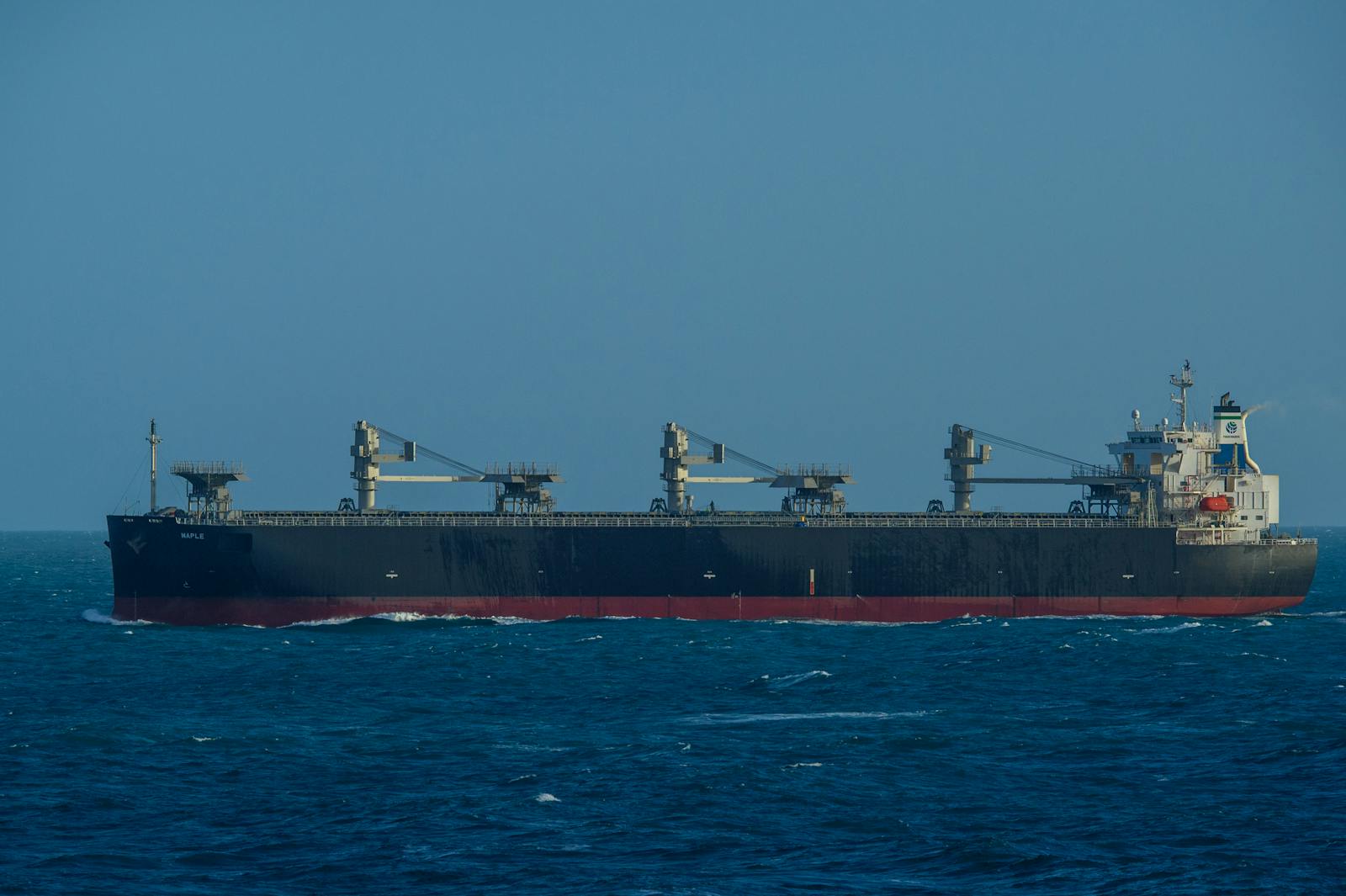 Geared bulk carrier navigating open sea